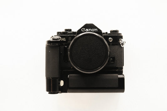 Canon A-1 + Motor Drive MA + 2 Lentes